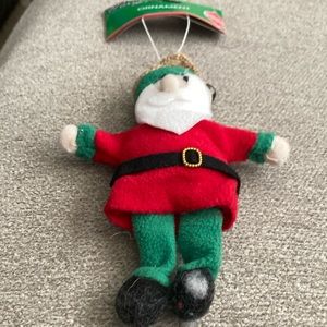 7 inch by 5.5 inch cloth Santa ornament with bell on cap